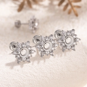 Sparkling snowflake tragus earrings in surgical steel with clear cubic zirconia settings