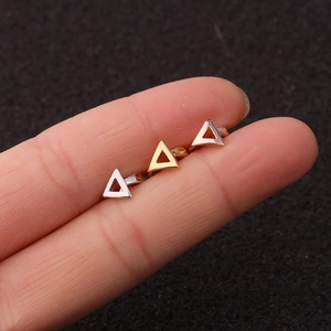 Detailed close-up of geometric hollow triangle stud earrings in silver gold and rose gold