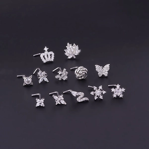 Set of 20G surgical steel nose studs featuring butterfly crown and zircon leaf designs