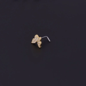 Macro shot of gold butterfly nose stud with micro-pave cubic zirconia and L-shaped pin