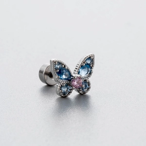 Titanium vlinder oorsteker met blauwe kristallen en roze zirkoon hart detail sieraad