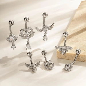 Set of 7 silver stainless steel belly rings with zircon stones and wing patterns