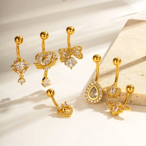 Golden belly rings set with sparkling zirconia featuring heart wings and butterfly designs