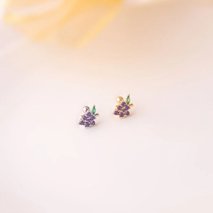 Detail of purple cubic zirconia grape stud earrings with screw-back in gold and silver finish