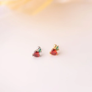 Macro view of red strawberry cubic zirconia stud earrings with stainless steel screw back