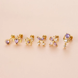 Set of six gold stainless steel ear studs with purple zircon hearts and butterfly bows