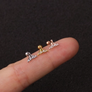 Set di tre orecchini a lobo a coda di balena in oro, argento e oro rosa con zirconi