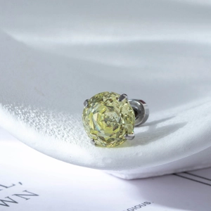 Sparkling yellow round zircon stud earring with four-claw silver-tone titanium steel setting
