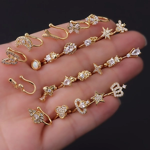 Golden non-piercing nose cuff set with micro-paved zircons in butterfly and star shapes