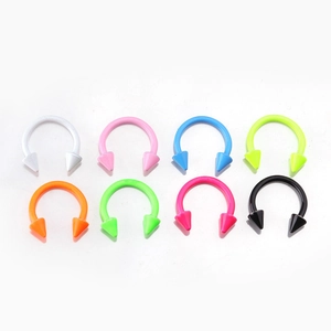 Detailed set of eight colorful C-shaped horseshoe rings with punk style spikes