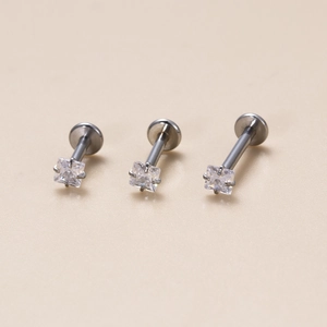 Three stainless steel labret studs with square cubic zirconia in varying lengths