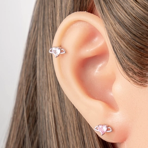 Titanium steel angel wing heart earrings with white and pink zircon stones on model