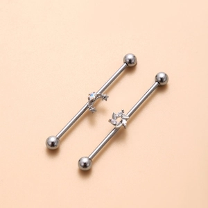 Industrial barbell earrings in stainless steel with moon, star and opal zircon detailing