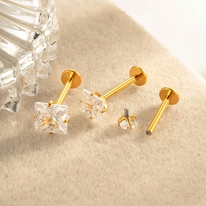 G23 titanium flat back labret stud with square zircon in a golden finish setting