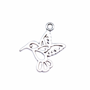 Antique silver hummingbird hollow alloy pendant for DIY jewelry making on white background