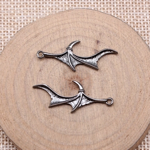 Pair of dark alloy bat wing pendants with bone texture for DIY jewelry making crafts
