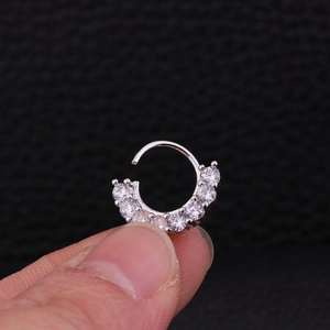 Ethnic crescent moon nose ring with pavé cubic zirconia in a silver metallic finish