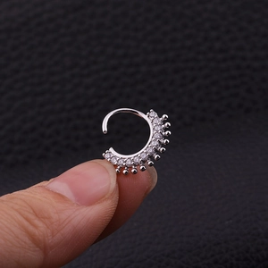 Silver septums ring featuring double row micro-inlaid zircons with beaded edge details