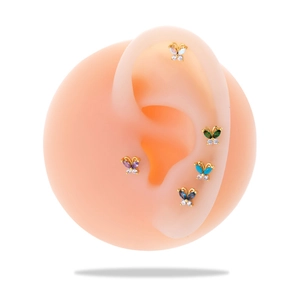 Set of 5 gold butterfly earrings with colorful zircon stones on a silicone ear display