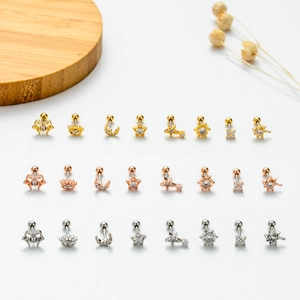 Detailed flat lay of stainless steel ear studs set with zircon stars and moon designs