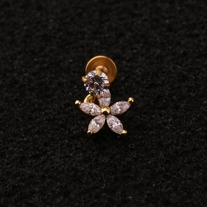 Macro shot of gold plated floral labret stud with sparkling marquise cut cubic zirconia