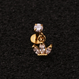 Macro view of gold stainless steel crown cartilage stud featuring marquise cut zircons