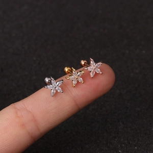 Detail showing mini flower stud earrings in silver gold and rose gold with screw ball back