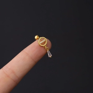 Detailed view of 16G gold stud earring featuring a round frame and dangling trapezoid zircon