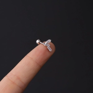 Macro detail of 16G stainless steel helix stud with rectangular zircon fan and ball back