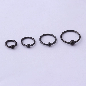 Set of four black stainless steel captive bead rings for ear and nose piercings