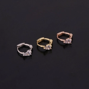 Detailed trio of pear-cut cubic zirconia hoop earrings in silver, gold, and rose gold