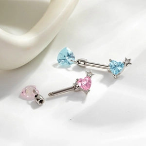 Star-shaped barbell jewelry with heart-cut crystals in pink and sky blue finishes