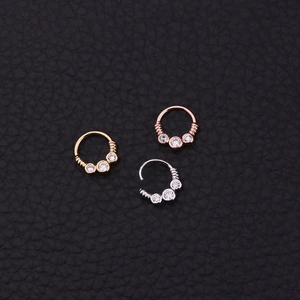 Detailed set of copper nose rings with zircon in gold, rose gold, and silver finishes