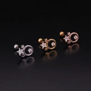 Lot de trois boucles d'oreilles étoiles et cercles en argent, or et or rose poli