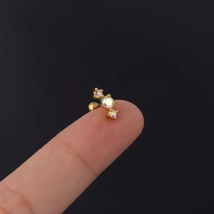 Macro shot of 20G stainless steel helix stud with colorful aurora borealis zircons