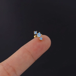 Detail of 20G stainless steel ear stud with three light blue cubic zirconia stones