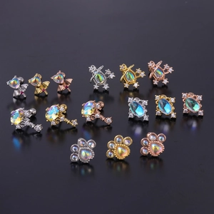 Selection of moonstone cartilage earrings in heart, crown key, and cat paw designs