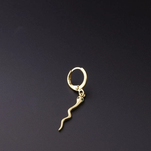 Golden snake drop earring with green gemstone eyes on a minimalist circular hoop