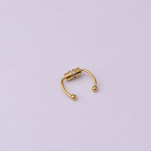 Polished golden stainless steel magnetic horseshoe nose ring without piercing on purple base