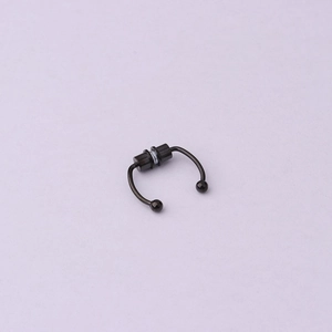 Detail of black magnetic fake septum ring with rounded ends and smooth metal finish