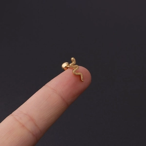 Detailed view of tiny golden snake stud earring with scale texture and ball back