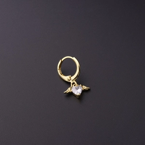Detailed view of a golden heart earring with crystal wings and secure hoop closure