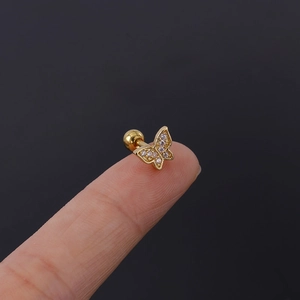 Detail of a 16G gold butterfly tragus stud with white crystals and screw back ball