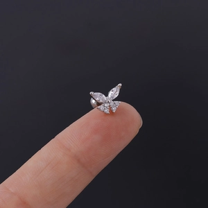 Detailed view of silver butterfly cartilage stud featuring sparkling white marquise zircons