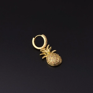 Macro view of gold pineapple dangle earring with micro-pave champagne zircons