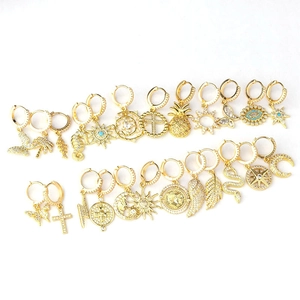 Gold plated earring set featuring micro-pasted zircon charms in assorted bohemian designs