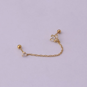 Detail of gold double piercing chain earring with sparkling marquise and round cubic zirconia
