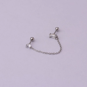 Detail of silver stainless steel double piercing earring with cubic zirconia and chain link