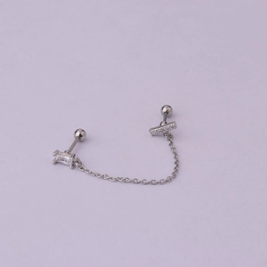 Detail of silver stainless steel chain earring with zircon stones and bar design