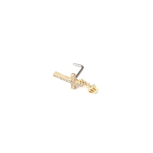 Detail of gold titanium steel cross nose stud with zircon crown pendant detail
